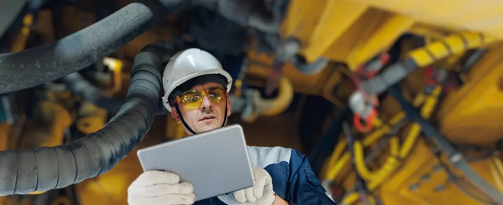 A worker interfacing with an Industrial SCADA interface